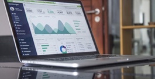 Laptop displaying charts