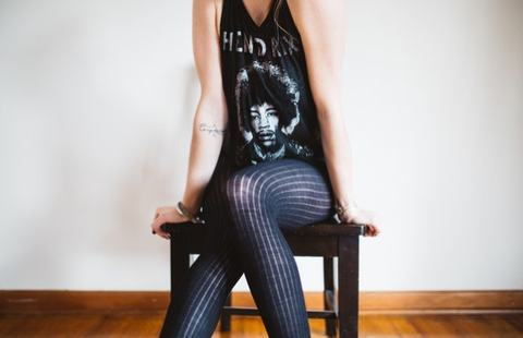 Woman wearing a Hendrix T-shirt and tights